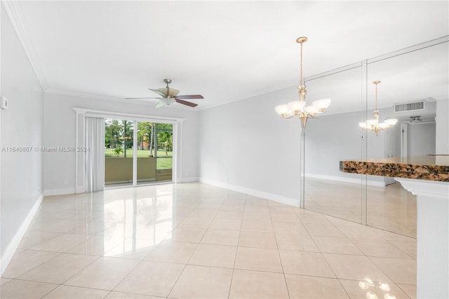 tiled empty room featuring ceiling fan with notable chandelier and ornamental molding