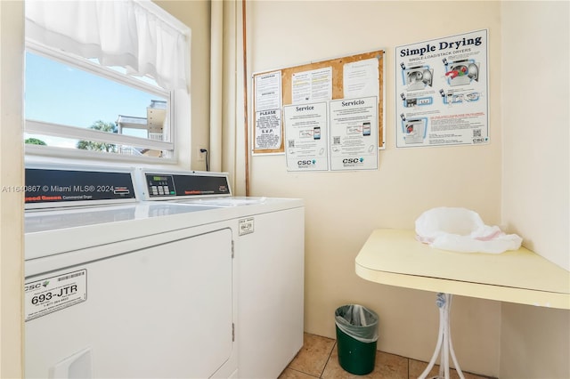 laundry room featuring independent washer and dryer and light tile patterned floors