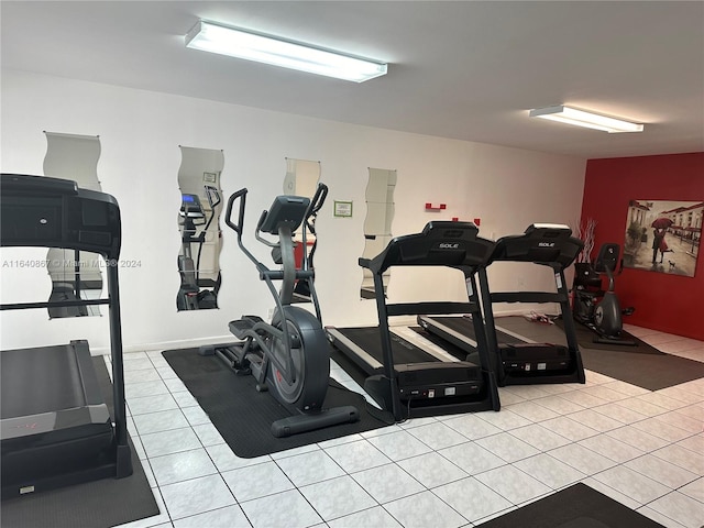 workout area with light tile patterned floors