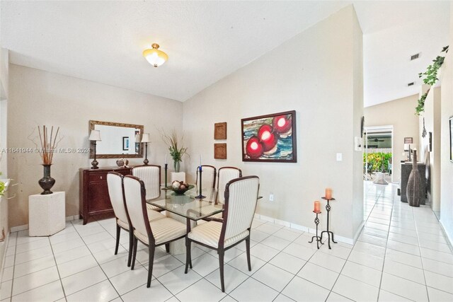 9045 NW 147th Ter, Miami Lakes, FL 33018 - dining room with lofted ceiling and light tile patterned flooring