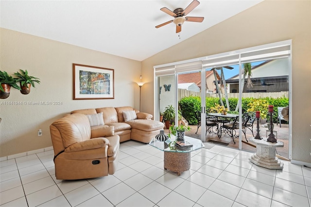 living room with light tile patterned floors, ceiling fan, and vaulted ceiling