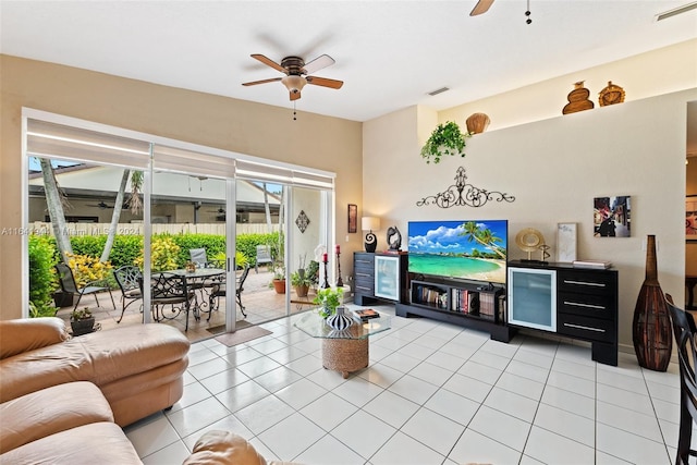 living room featuring ceiling fan, visible vents, and light tile patterned flooring