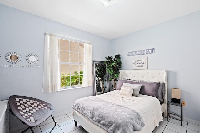 9045 NW 147th Ter, Miami Lakes, FL 33018 - bedroom with light tile patterned floors and baseboards