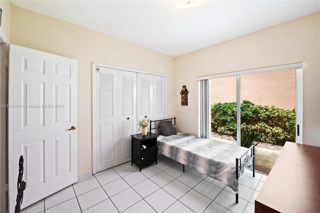 bedroom featuring a closet and light tile patterned flooring