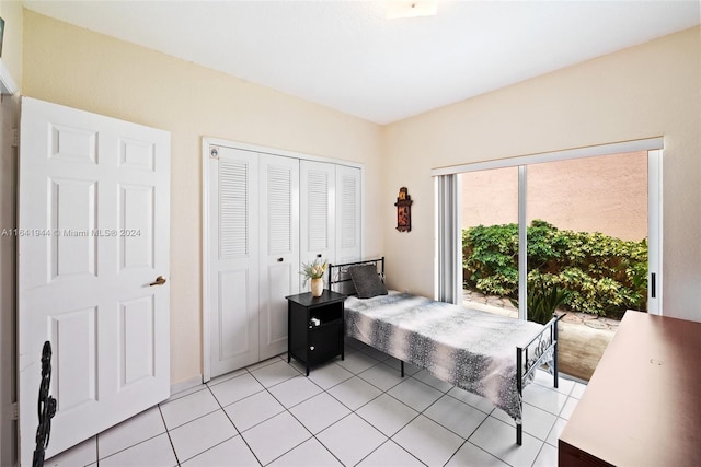 9045 NW 147th Ter, Miami Lakes, FL 33018 - bedroom with light tile patterned floors and a closet