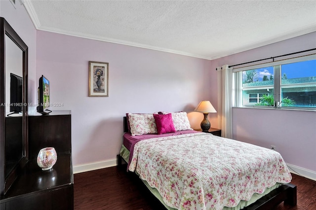 bedroom featuring a textured ceiling, dark hardwood / wood-style floors, and ornamental molding