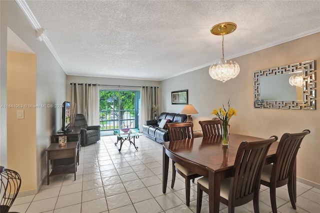 dining room featuring a textured ceiling and ornamental molding