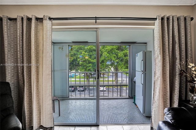 doorway with light tile patterned floors