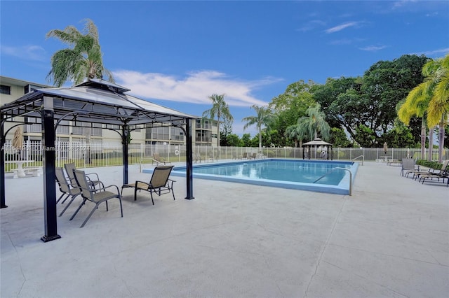 view of pool with a patio and a gazebo