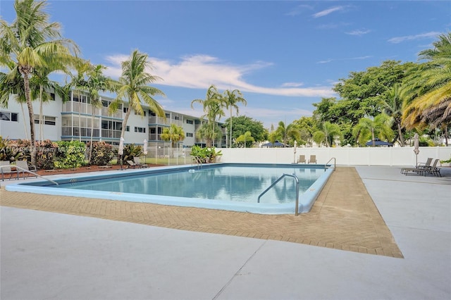 view of swimming pool featuring a patio area