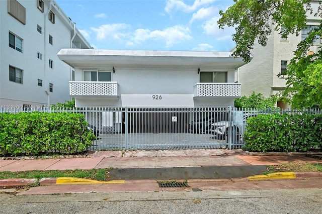 view of front of property with a balcony