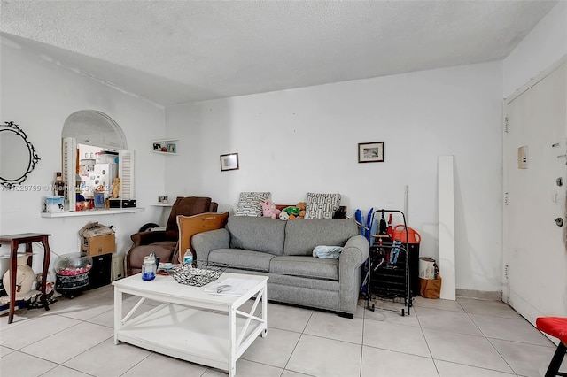 tiled living room with a textured ceiling