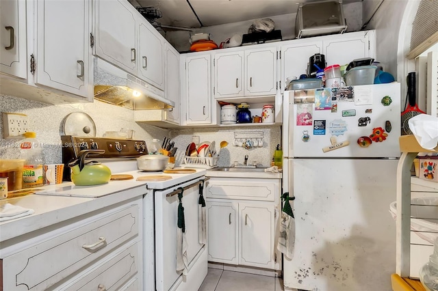 kitchen with backsplash, sink, white cabinets, light tile patterned floors, and white appliances