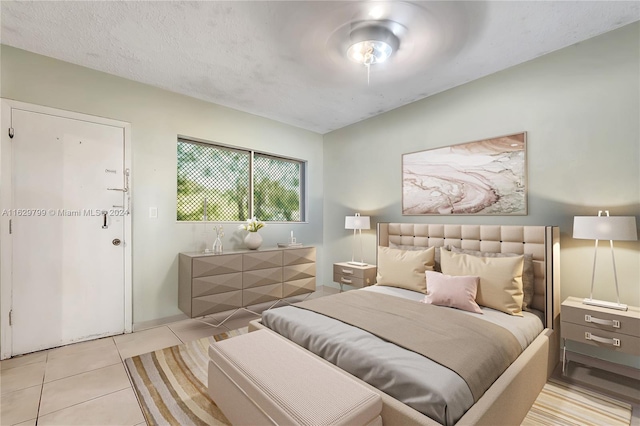 bedroom featuring light tile patterned floors