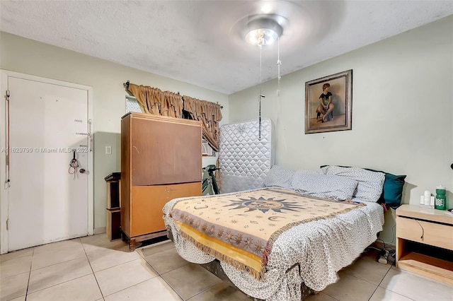 bedroom with light tile patterned flooring