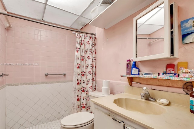 bathroom with tile patterned floors, vanity, and toilet