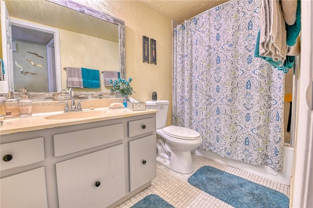 bathroom featuring toilet, tile patterned floors, and vanity