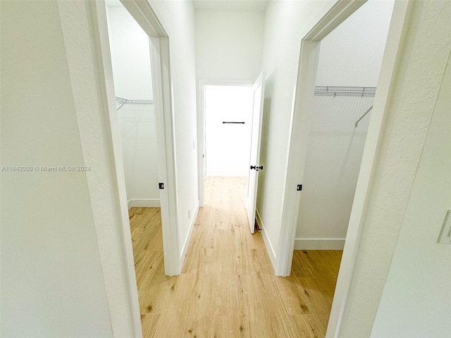 hall with light hardwood / wood-style flooring