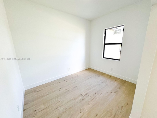 spare room featuring light hardwood / wood-style floors