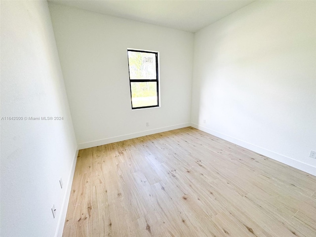 empty room with light wood-type flooring