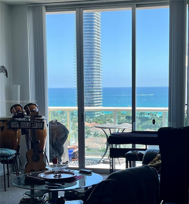 dining area with a beach view and a water view