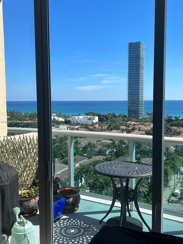 balcony featuring grilling area and a water view