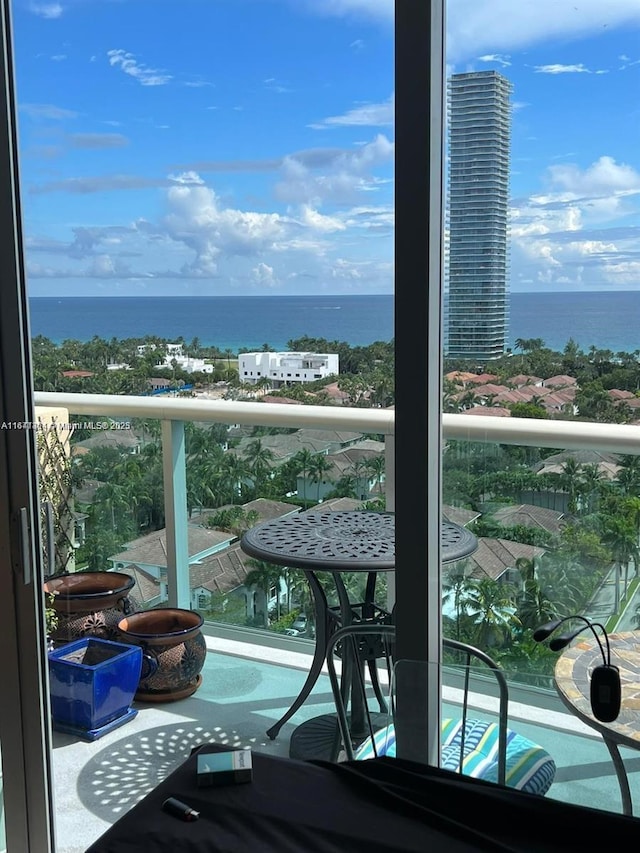 balcony featuring a water view