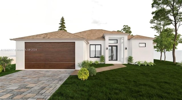 view of front facade with a front yard and a garage