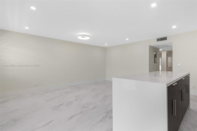 kitchen with visible vents, a center island, marble finish floor, light countertops, and recessed lighting