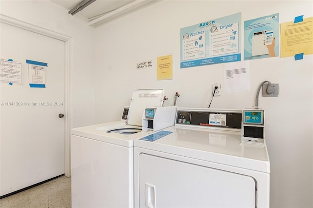 laundry area featuring washing machine and clothes dryer