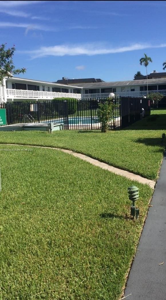 view of yard featuring a community pool