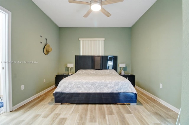 bedroom featuring ceiling fan and light hardwood / wood-style flooring