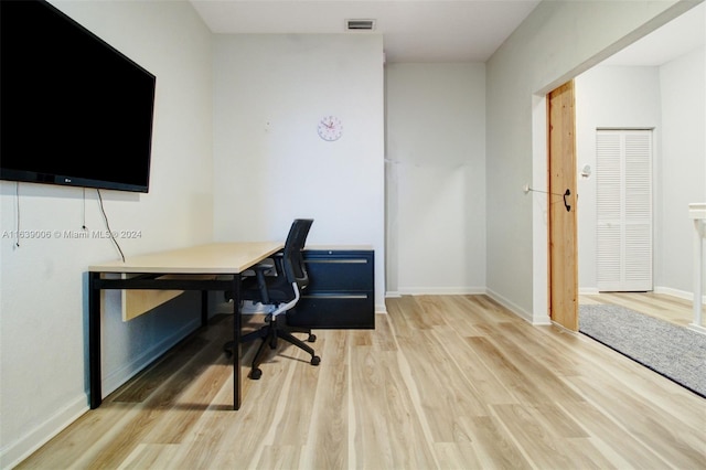 office space with light hardwood / wood-style flooring