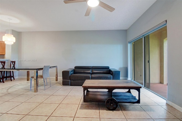 living room with light tile patterned flooring and ceiling fan