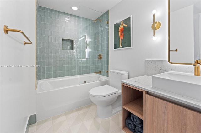 full bathroom with tile patterned floors, toilet, vanity, and tiled shower / bath