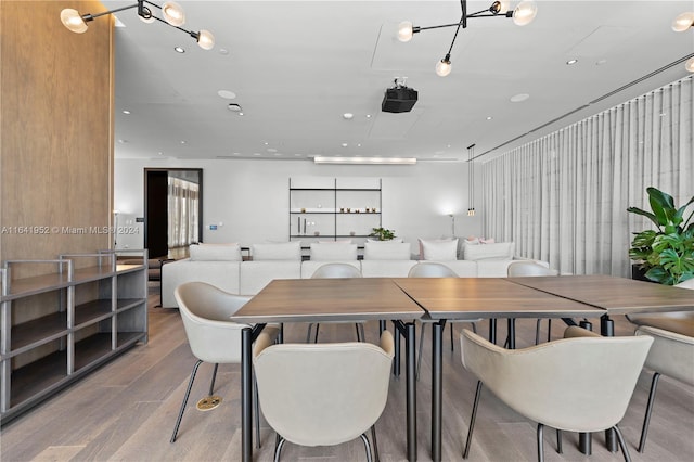 dining area with hardwood / wood-style floors