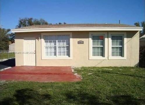 view of property exterior with a lawn