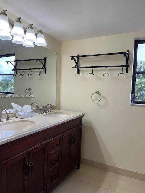 bathroom with tile patterned flooring and vanity