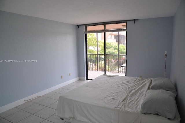 tiled bedroom featuring access to outside