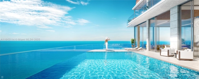 view of swimming pool with a water view and a patio