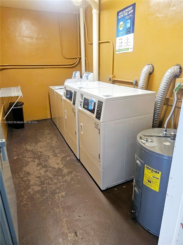 washroom featuring water heater and washer and clothes dryer