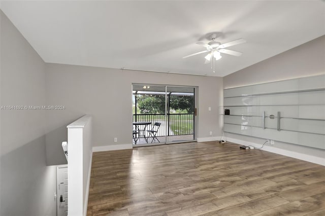 unfurnished living room featuring lofted ceiling, wood-type flooring, and ceiling fan