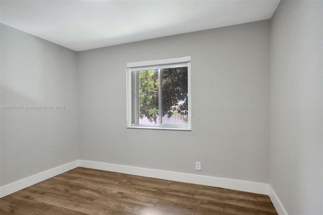 unfurnished room featuring hardwood / wood-style floors