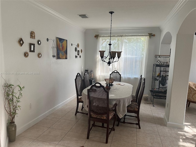 6049 SW 165th Ave, Miami, FL 33193 - dining room featuring arched walkways, ornamental molding, and light tile patterned floors