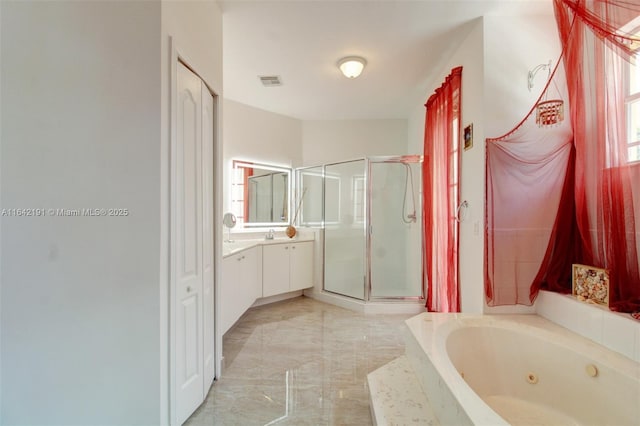 full bath featuring visible vents, marble finish floor, vanity, a stall shower, and a jetted tub