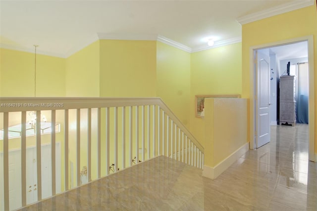 corridor with marble finish floor, baseboards, crown molding, and an upstairs landing