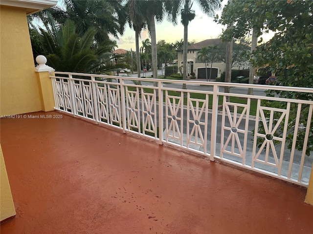 view of balcony at dusk