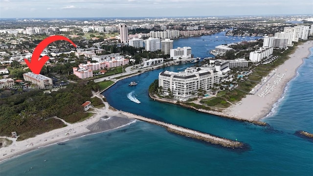 bird's eye view with a water view and a view of the beach