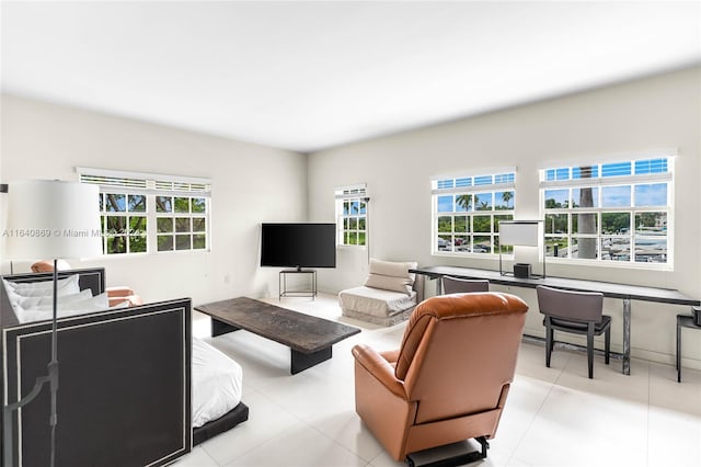 living room featuring plenty of natural light and light tile patterned flooring