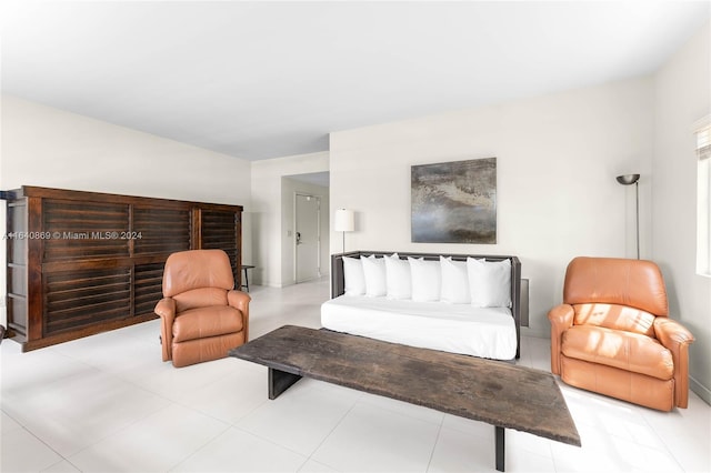 bedroom with light tile patterned flooring